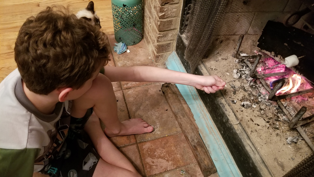 Noah toasting a marshmallow